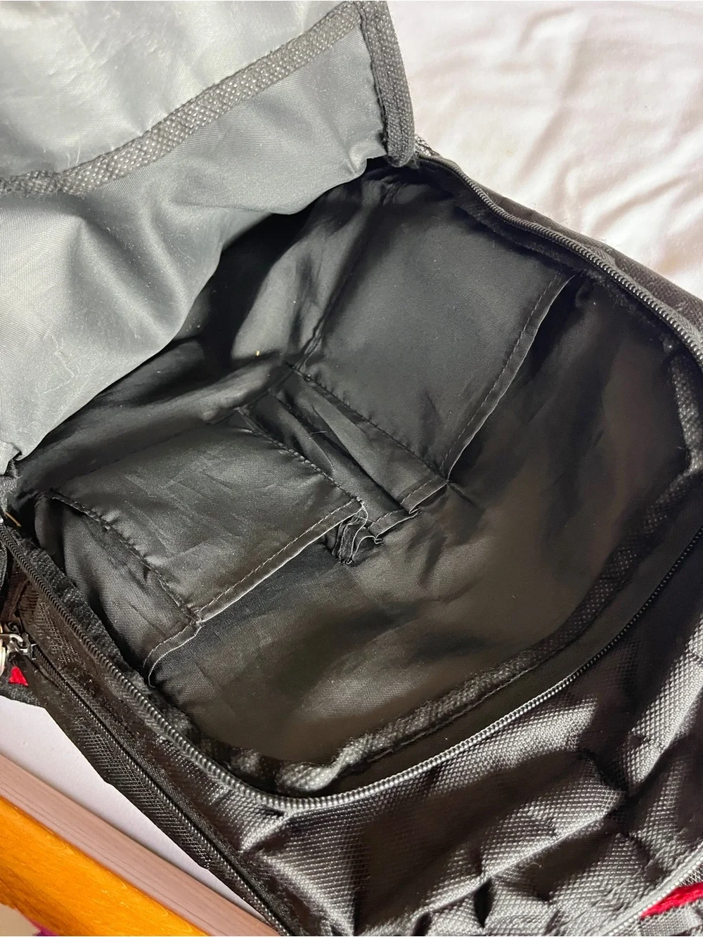 Black & Red Multi-Pocket Backpack with Media Port & Mesh Side Pockets